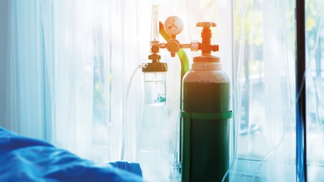 oxygen-tank-beside-patient-bed-in-hospital