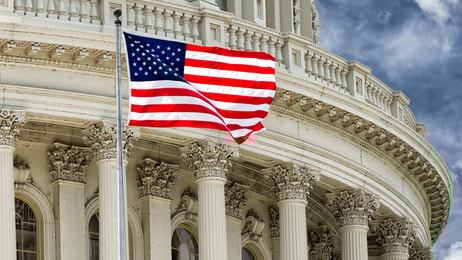 Washington DC Capitol dome detail with waving american flag