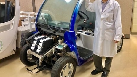 Xianguo Li with fuel cell test vehicle