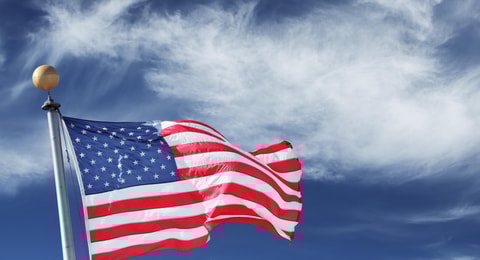 1032119_usa.windblownflagoftheunitedstatesofamericaoverskybackground._71541